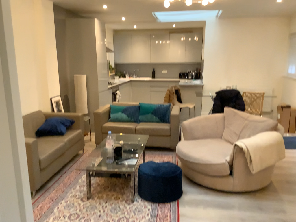 Reference photograph of the second living room and kitchen